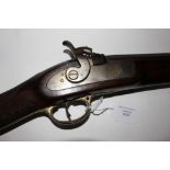 A Percussion cap rifle. Working action. 49 inch long barrel. Brass trigger guard. No makers marks.