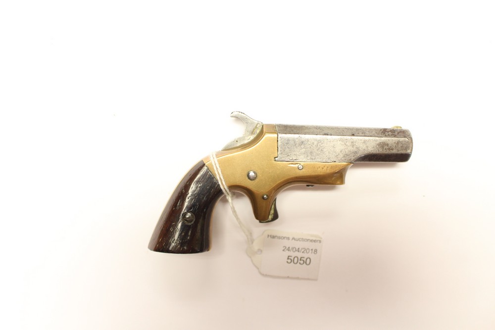 A Brass Framed .41 cal rimfire Derringer Pistol by Brown Mf Co Newburyport Mass Pat Apr 9 1867.