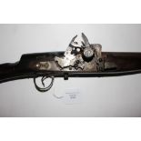 A Flintlock "Camel Gun" with brass mounts. 50 inch barrel. Overall length 169cm. Action a/f.