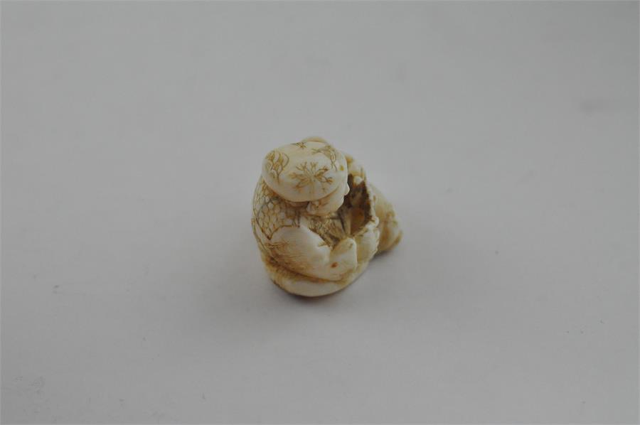 A Japanese Meiji period carved ivory netsuke, of parent and child, signed, height 2.7 cm. - Image 4 of 6