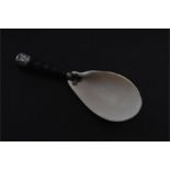 A large Burmese white metal mounted spoon, late 19th/early 20th century, the bowl fashioned from