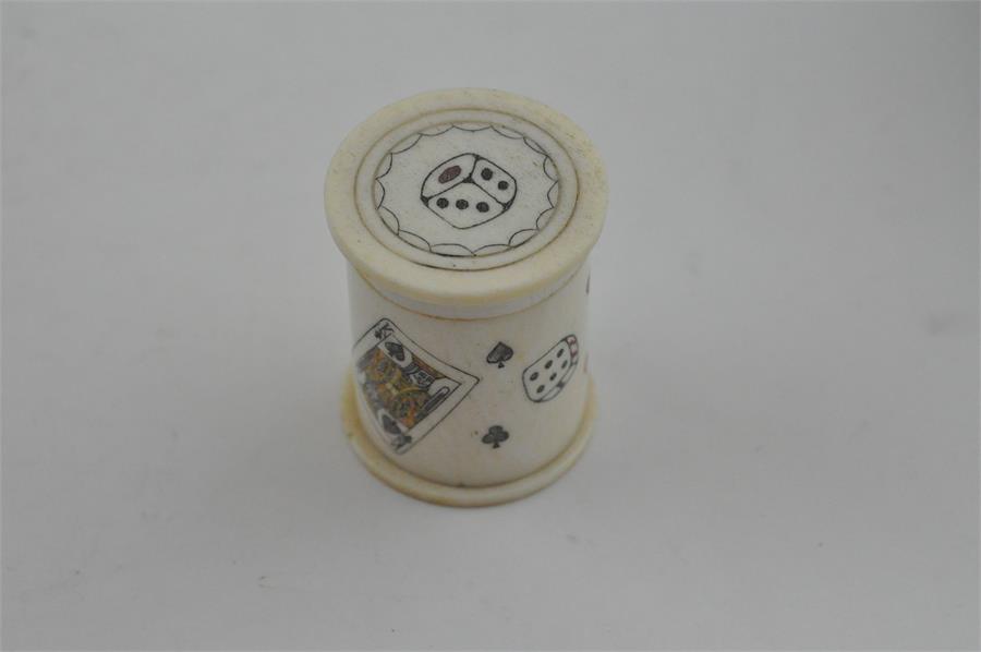 A turned, carved and stained ivory dice shaker/case and dice, 19th century. the case/shaker of