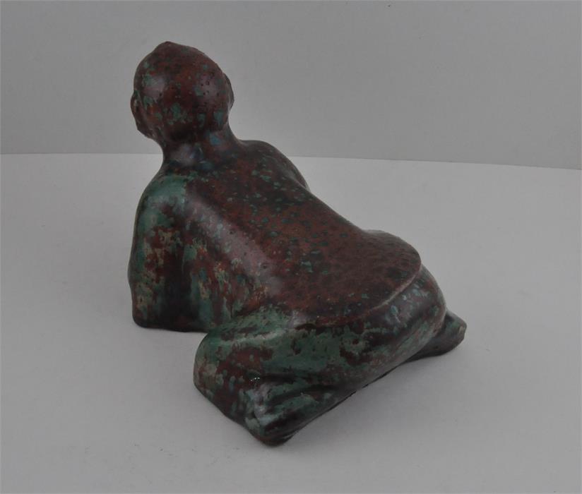 A Chinese high fired boy pillow rest, probably Republic Period. Approx 25cms long x 17cms high. - Image 2 of 3