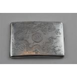 A Chinese export silver cigarette case, of gently curved form, having dragon engraved to top,