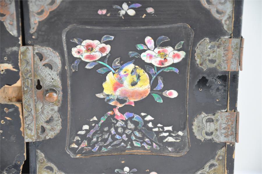 A Chinese black lacquered and mother of pearl inlaid table top cabinet, having painted mother of - Image 2 of 5