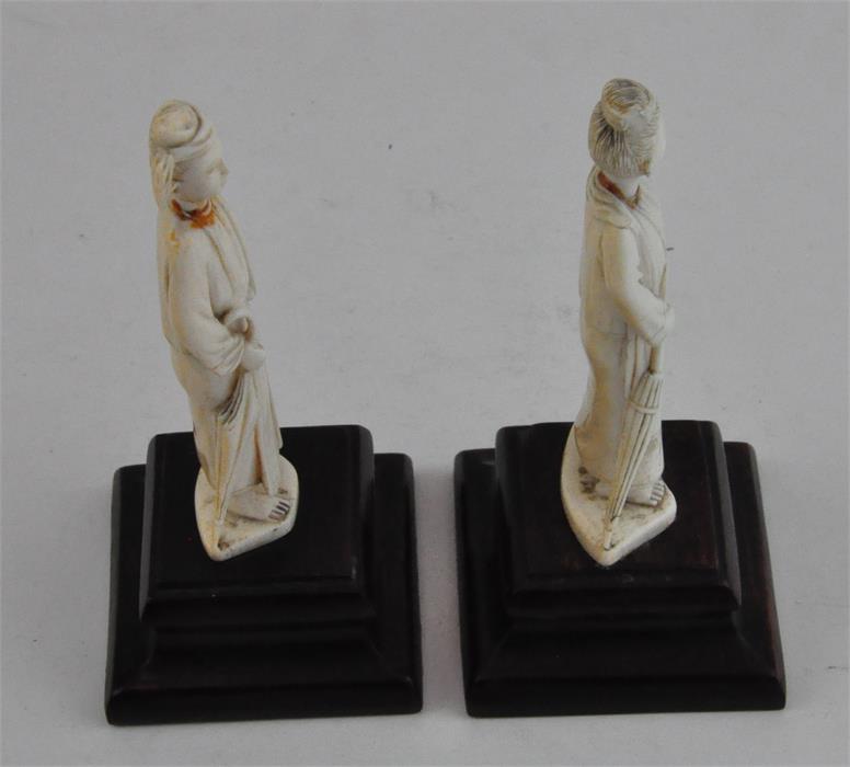 Two South East Asian carved ivory figures, early 20th century, both adorned in robes and holding a - Image 4 of 5