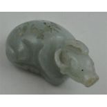 A Chinese jade figure of a recumbent buffalo, probably 19th century, length 6.1 cm.