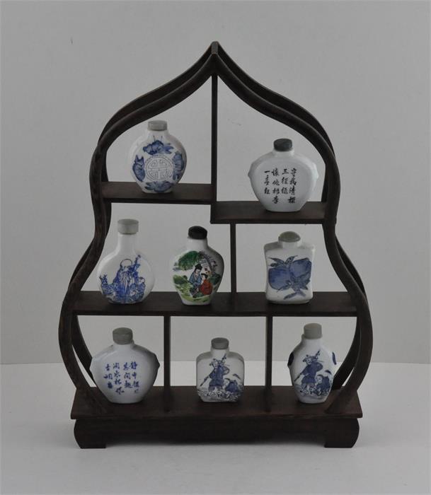 Eight 20th cent Chinese republic snuff bottles on a wooden stand (9 items total) - Image 2 of 2