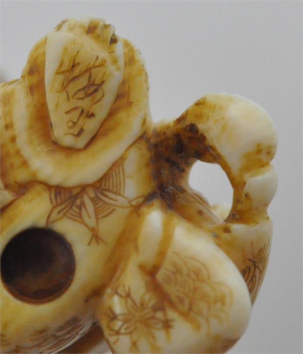 A Japanese Meiji period carved ivory netsuke, of parent and child, signed, height 2.7 cm. - Image 6 of 6