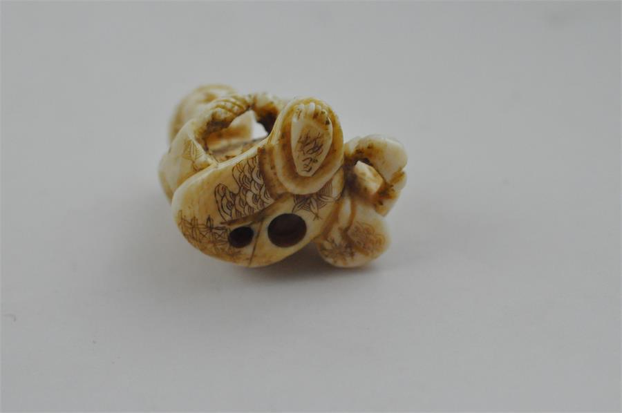 A Japanese Meiji period carved ivory netsuke, of parent and child, signed, height 2.7 cm. - Image 5 of 6