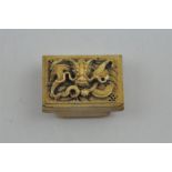 A Chinese late Qing dynasty carved ivory belt buckle, of rectangular form relief carved with