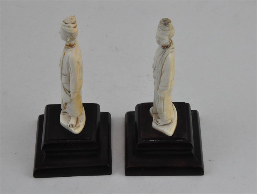 Two South East Asian carved ivory figures, early 20th century, both adorned in robes and holding a - Image 2 of 5