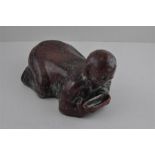 A Chinese high fired boy pillow rest, probably Republic Period. Approx 25cms long x 17cms high.