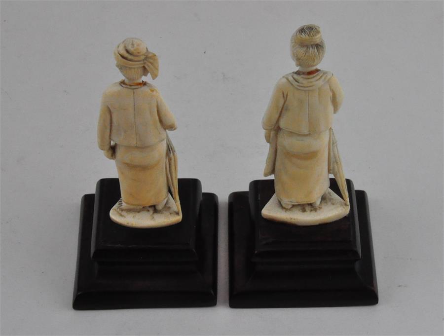 Two South East Asian carved ivory figures, early 20th century, both adorned in robes and holding a - Image 3 of 5