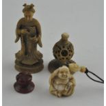 A Japanese late Meiji period carved ivory netsuke of Hotei, sat cross legged, signed, height 3.5