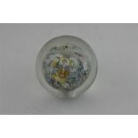 A Chinese reverse painted glass paperweight, early 20th century, of spherical form, interior reverse