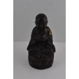 A Chinese 20th cent  Bronze Buddha with gold splash work design