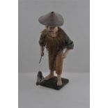 A composition Japanese model of a fisherman, with fish on stand. Approx 34cms high.