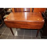 An Edwardian mahogany drop leaf table, fitted with a single frieze drawer to one ide,