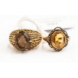 Two 9ct gold dress rings, comprising a smoky quartz set ring with heavily patterned mount,