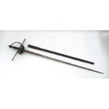 A Victorian era Dress Sword with 70cm blade. No makers marks. Complete with scabbard with chape a/f.