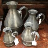 A set of four pewter vessels,