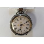 A ladies silver fob watch, Swiss hallmark, white enamel dial,