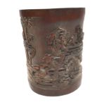 A 19th Century Chinese bamboo brush pot decorated with attendants and calligraphy