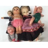 A collection of 3 Celluloid dolls, along with a Nora Wellings sailor doll,