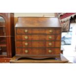 An Edwardian mahogany bureau, the fall enclosing a fitted interior with drawers,