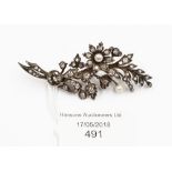 A diamond and pearl floral spray brooch, with diamond and pearl set leaf and flower details,