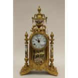 A gilded French clock, marked 'Imperial' to dial, Roman numerals,