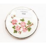 An Elizabeth II silver mounted enamel compact, engine turned base,