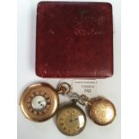 A group of three pocket watches including a Waltham half hunter in gilt metal,
