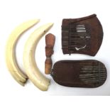 A collection of African ethnographic interest items to include two African thumb pianos (mbira),