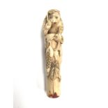 An early 19th Century carved ivory walking stick handle,