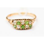 A Victorian diamond and peridot double row ring, claw set with yellow metal, probably 15ct,