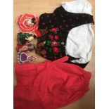 A Bavarian National Outfit black ground with floral pattern, attached with blouse and red apron,