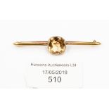 A citrine bar brooch set in 18ct gold,