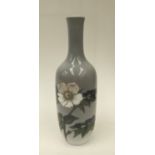 A Royal Copenhagen narrow necked vase with floral decoration.