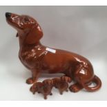 A large Beswick 1950s Dachshund and two Beswick small Dachshunds (3)