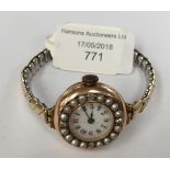 A 14ct gold diamond and seed pearl early wrist watch,