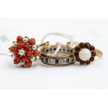 A collection of three 9ct gold rings, comprising a garnet and opal set flower cluster,