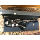 Black enamel tenor saxaphone in case,