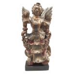 A Thai carved wood figure, early 19th century, having remains of polychrome decoration,