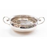 A Victorian silver plain two handled bowl, C-scroll handles, Josiah Williams & Co., London, 1897, 3.