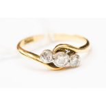 An 18ct gold and diamond three stone ring