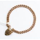 A heavy solid gold link bracelet with heart shaped padlock clasp, weight approx 19.