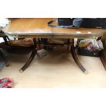 A Regency style mahogany twin pedestal dining table