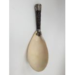 A large Burmese white metal mounted spoon, late 19th/early 20th century,